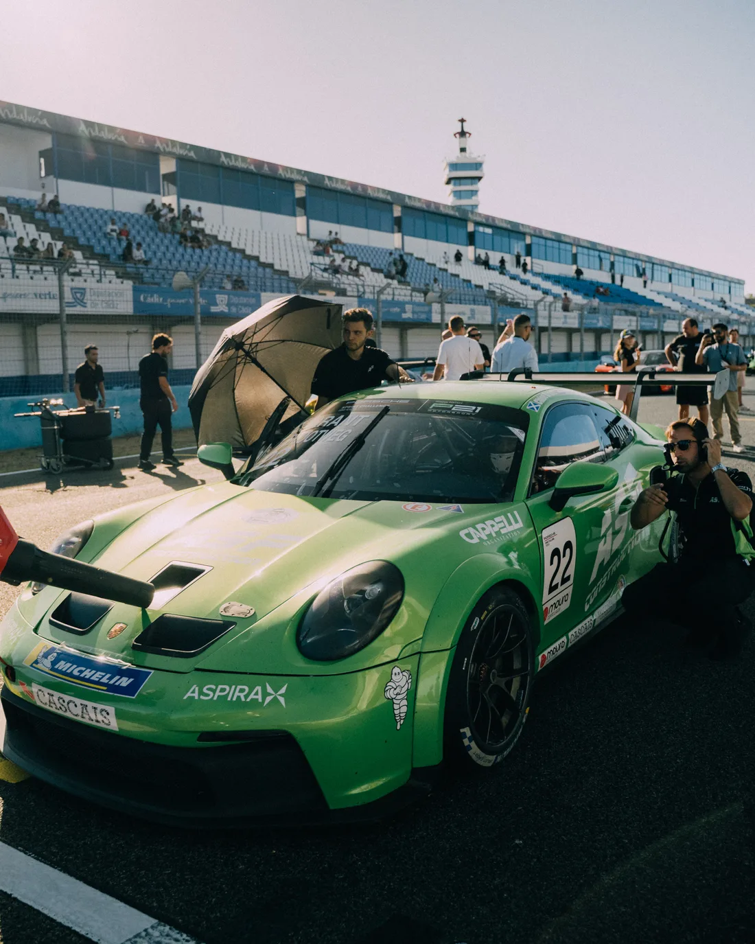 Chloe Grant’s green number 22 Porsche 911 Cup car on the grid