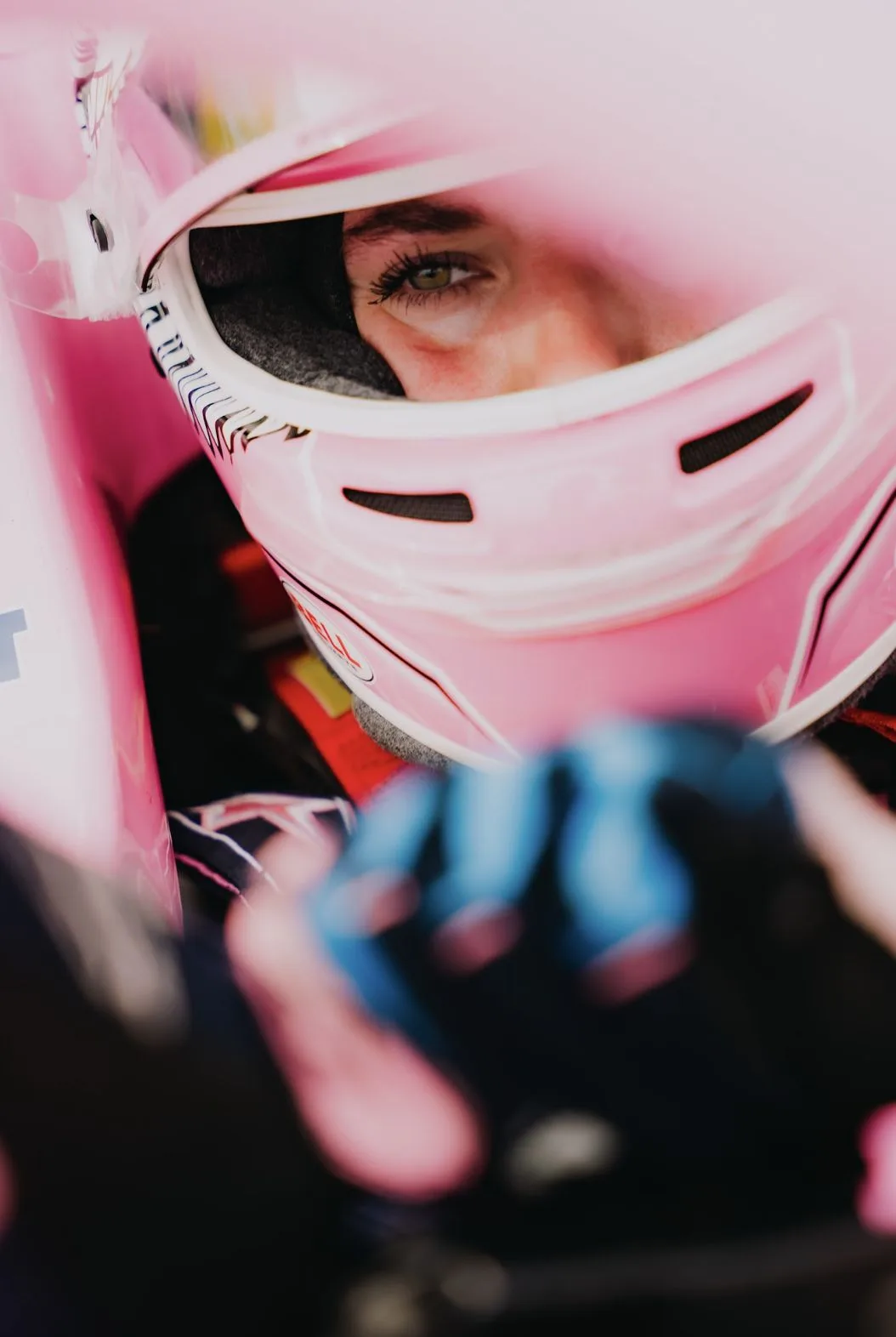 Nina Gademan in the car, helmet on
